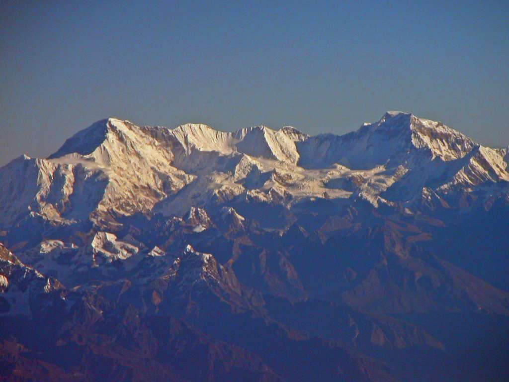 Manaslu 00 02 Cho Oyu From Flight To Kathmandu As we waited for Kathmandu cloud cover to clear, we had a beautiful early morning view of the long ice ridge connecting Cho Oyu (8201m) to Gyachung Kang (7952m).